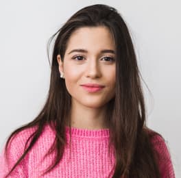 young woman in pink pullover